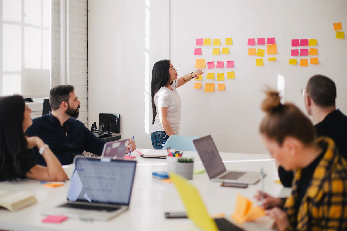 Confident leader guiding a team discussion in a modern office