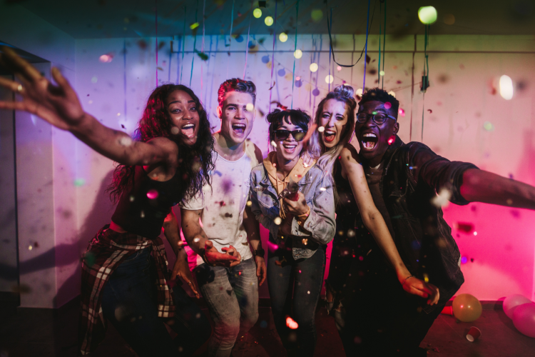 Group of friends celebrating and having fun together at a party